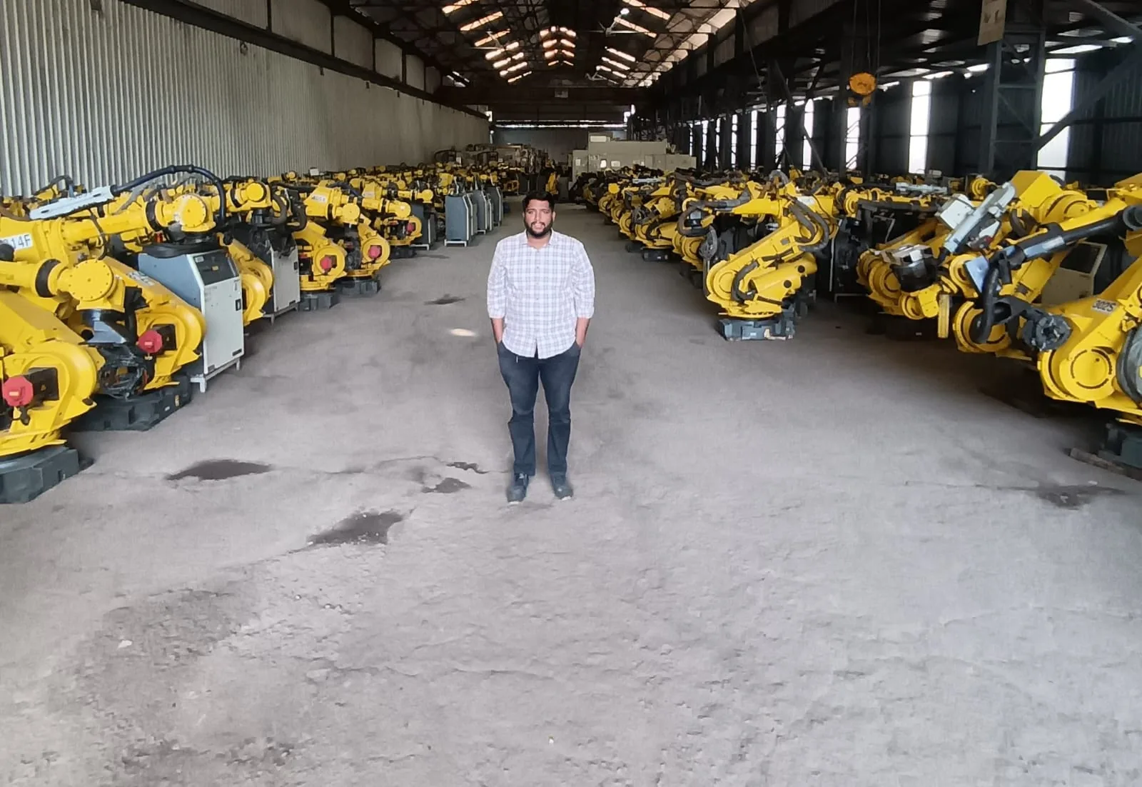 Large warehouse full of FANUC industrial robots